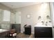 This bathroom features a glass shower, soaker tub, and dark vanity at 1976 Boyd Trace Nw Ln, Atlanta, GA 30318
