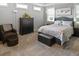 Comfortable bedroom features carpet, a large bed, and a dark wood dresser at 1976 Boyd Trace Nw Ln, Atlanta, GA 30318