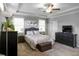 This bedroom has a ceiling fan, a large window, and gray paint at 1976 Boyd Trace Nw Ln, Atlanta, GA 30318