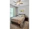 Comfortable bedroom with carpet, a ceiling fan, and natural light at 1976 Boyd Trace Nw Ln, Atlanta, GA 30318