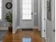 Inviting entryway with hardwood floors, light gray walls, and a bright white front door at 1976 Boyd Trace Nw Ln, Atlanta, GA 30318