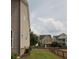 Street view of neighborhood homes with wood fences and well-manicured lawns on a sunny day at 1976 Boyd Trace Nw Ln, Atlanta, GA 30318