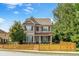 Charming two-story home with a well-maintained lawn and a quaint picket fence enhancing its curb appeal at 1976 Boyd Trace Nw Ln, Atlanta, GA 30318