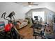 Bright and airy home gym space with hardwood floors, ceiling fan, a work space and comfortable seating area at 1976 Boyd Trace Nw Ln, Atlanta, GA 30318