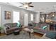 Bright and open living room with hardwood floors, contemporary furniture, and modern lighting fixtures at 1976 Boyd Trace Nw Ln, Atlanta, GA 30318