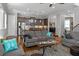Comfortable living room featuring hardwood floors, stylish sofas, and a view of the modern kitchen at 1976 Boyd Trace Nw Ln, Atlanta, GA 30318