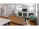 Cozy living room with a fireplace, hardwood floors, and ample natural light at 1976 Boyd Trace Nw Ln, Atlanta, GA 30318