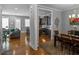 Open-concept living space with hardwood floors seamlessly connecting the kitchen, dining, and living areas at 1976 Boyd Trace Nw Ln, Atlanta, GA 30318