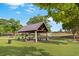 Picturesque picnic area with tables and benches under a covered structure in a park at 1976 Boyd Trace Nw Ln, Atlanta, GA 30318