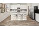 Bright kitchen features modern appliances, counter seating and views from windows at 1129 Georgian Point Dr, Lawrenceville, GA 30045