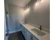 Bathroom with double vanity sinks, modern fixtures, and a separate glass-enclosed shower at 1274 Longreen Terrace # 113, Atlanta, GA 30318