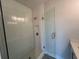 Bathroom featuring a glass door shower, white subway tile, and contemporary fixtures at 1274 Longreen Terrace # 113, Atlanta, GA 30318