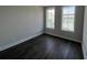 Bedroom with hardwood floors and light gray walls with two large windows for ample light at 1274 Longreen Terrace # 113, Atlanta, GA 30318