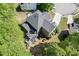 Aerial view of the home's deck and backyard among lush green surroundings at 1641 Rocky Knoll Ln, Dacula, GA 30019