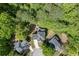 Aerial view of a house nestled among trees and other houses in the community at 1641 Rocky Knoll Ln, Dacula, GA 30019