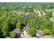 Aerial view of a neighborhood, showcasing its lush greenery, serene setting, and quiet cul-de-sac at 1641 Rocky Knoll Ln, Dacula, GA 30019
