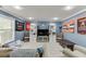 Spacious basement area with large windows, shelving, and comfortable seating at 1641 Rocky Knoll Ln, Dacula, GA 30019