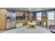 Basement features a functional kitchenette with stainless steel refrigerator and custom cabinetry at 1641 Rocky Knoll Ln, Dacula, GA 30019