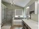 Bathroom featuring double vanity, a standalone tub, and walk-in shower at 1641 Rocky Knoll Ln, Dacula, GA 30019