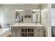 Bathroom features a double vanity, grey cabinets, and stone backsplash at 1641 Rocky Knoll Ln, Dacula, GA 30019