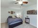 Cozy bedroom featuring carpet flooring, a ceiling fan, and natural light at 1641 Rocky Knoll Ln, Dacula, GA 30019