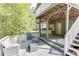 Multi-level deck featuring comfortable seating and wooded backyard views at 1641 Rocky Knoll Ln, Dacula, GA 30019