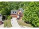Beautiful two-story brick home with a manicured lawn and mature trees in a desirable neighborhood at 1641 Rocky Knoll Ln, Dacula, GA 30019