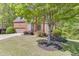 Traditional brick home with lush landscaping, mature tree and an inviting curb appeal at 1641 Rocky Knoll Ln, Dacula, GA 30019