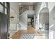 Inviting foyer with hardwood floors, staircase, and elegant architectural details at 1641 Rocky Knoll Ln, Dacula, GA 30019