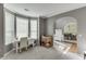 Comfortable home office area with lots of natural light and access to the dining room at 1641 Rocky Knoll Ln, Dacula, GA 30019