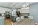 Bright kitchen featuring white cabinets, stainless appliances, and a granite island alongside a cozy dining space at 1641 Rocky Knoll Ln, Dacula, GA 30019