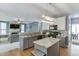 Open concept kitchen featuring granite countertops, stainless steel appliances, and view to living room at 1641 Rocky Knoll Ln, Dacula, GA 30019