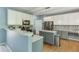 Kitchen featuring white cabinets, gray countertops, stainless steel appliances, and decorative backsplash at 1641 Rocky Knoll Ln, Dacula, GA 30019