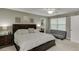 Carpeted main bedroom with grey paint, ceiling fan, and futon at 1641 Rocky Knoll Ln, Dacula, GA 30019