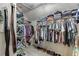 Walk-in closet with adjustable shelving, clothes racks, and ample storage at 1641 Rocky Knoll Ln, Dacula, GA 30019