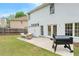 A cozy patio with outdoor seating and a grill, located in a well-kept backyard at 2263 Seatton Ct, Marietta, GA 30062