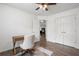 Bedroom with wood floors, a desk and chair, and natural light with view to adjacent bedroom at 2263 Seatton Ct, Marietta, GA 30062