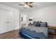 Cozy bedroom with a ceiling fan, closet with double doors, and hardwood flooring at 2263 Seatton Ct, Marietta, GA 30062
