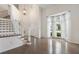 Bright foyer with hardwood floors, grand staircase and large bay windows at 2263 Seatton Ct, Marietta, GA 30062