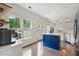 Bright kitchen with a blue island, stainless steel appliances, and hardwood floors at 2263 Seatton Ct, Marietta, GA 30062