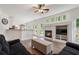 Open concept living room featuring a fireplace, large windows, and hardwood flooring at 2263 Seatton Ct, Marietta, GA 30062