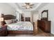 Spacious main bedroom with a tray ceiling, ceiling fan, walk-in closet, and wood floors at 2263 Seatton Ct, Marietta, GA 30062