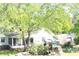 Spacious backyard featuring a wooden playset, lush greenery and access to the house at 4045 Fawn Valley Dr, Loganville, GA 30052