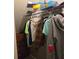 Walk-in closet with shelving holding clothes, games, and personal items at 4045 Fawn Valley Dr, Loganville, GA 30052