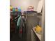 Walk-in closet with shelving holding clothes, games, and personal items at 4045 Fawn Valley Dr, Loganville, GA 30052