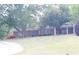 Charming single-story brick home with lush green lawn and mature trees at 4045 Fawn Valley Dr, Loganville, GA 30052
