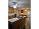 Charming kitchen features an island with a sink, wooden cabinetry, and a cozy breakfast nook at 4045 Fawn Valley Dr, Loganville, GA 30052