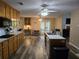 Spacious kitchen boasts an island, stainless steel appliances, and an open layout connecting to dining area at 4045 Fawn Valley Dr, Loganville, GA 30052
