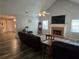 Spacious living room features vaulted ceiling, fireplace, plank flooring, and plenty of natural light at 4045 Fawn Valley Dr, Loganville, GA 30052