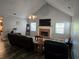Spacious living room features vaulted ceiling, fireplace, plank flooring, and plenty of natural light at 4045 Fawn Valley Dr, Loganville, GA 30052
